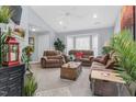 Cozy living room with plush sofas, vaulted ceiling, and plenty of natural light at 1516 Greys Mill Rd, Rocky Mount, NC 27804