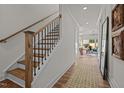 Inviting foyer with hardwood floors and staircase, leading to an open living area at 215 Faith Avenue, Sanford, NC 27330