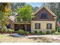 Charming home with stone and siding exterior, manicured lawn, and inviting front porch at 240 Oak Grove Church Rd, Youngsville, NC 27596