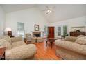 Cozy living room with vaulted ceilings, fireplace, and comfortable seating at 313 Teresa Dr, Rolesville, NC 27571