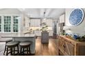 Bright kitchen features a center island, granite countertops, and stainless steel appliances at 317 Chanticlair Dr, Apex, NC 27502