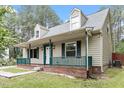 Charming home featuring a cozy front porch and dormer windows at 4709 Tyne Dr, Durham, NC 27703