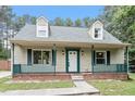 Charming home featuring a cozy front porch and dormer windows at 4709 Tyne Dr, Durham, NC 27703