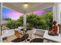 Cozy covered patio with outdoor seating and a serene view of lush greenery, ideal for relaxation at 800 Savannah Ridge Rd # 109, Holly Springs, NC 27540