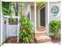 Charming front porch with stone steps, a black door, and a circular window at 805 N Columbia St, Chapel Hill, NC 27516