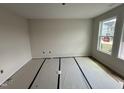 Bright, carpeted bedroom with large windows providing ample natural light at 88 W Emily Gardens Dr, Selma, NC 27576