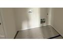 Compact laundry area with connections for washer and dryer at 88 W Emily Gardens Dr, Selma, NC 27576