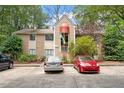 Inviting exterior showcasing a well-maintained home with ample parking and lush landscaping at 1009 Iredell St # D, Durham, NC 27705