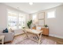 Bright home office with large windows, a wooden desk, and cozy decor at 1601 Merry Mdw Way, Wendell, NC 27591