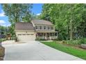 Inviting two-story home with a spacious driveway and attached two-car garage at 203 W Hill Dr, Cary, NC 27519