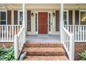 Welcoming front porch with brick steps and decorative details at 203 W Hill Dr, Cary, NC 27519