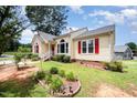 Charming single-Gathering home with a red front door and well maintained lawn at 220 Needle Park Dr, Cary, NC 27513