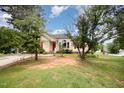 Charming single-Gathering home with a red front door and well maintained lawn at 220 Needle Park Dr, Cary, NC 27513