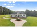 Beautiful single-Gathering home featuring a circular driveway and well-kept lawn at 2493 Nc-242, Benson, NC 27504