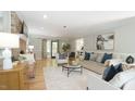 Spacious living room featuring hardwood floors, fireplace, and lots of natural light at 304 Ramblewood Dr, Raleigh, NC 27609