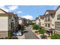 Inviting street view showcases rows of townhomes with well-maintained landscaping and tree-lined street at 341 View Dr, Morrisville, NC 27560