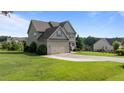 Well-maintained two-story home with a two-car garage and spacious yard at 3525 Daisy Ln, Wake Forest, NC 27587