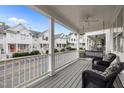 Relaxing front porch with comfortable seating, including a porch swing, overlooking the neighborhood at 3902 Stags Leap Cir, Raleigh, NC 27612