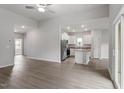 Open-concept living area with wood-look floors and eat-in kitchen at 405 Benton Dr, Oxford, NC 27565