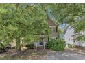 Charming two-story home with a well-maintained front yard and a classic facade, showcasing its inviting curb appeal at 4825 Windbreak Ln, Raleigh, NC 27616