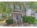 Charming two-story home with a well-maintained front yard and a classic facade, showcasing its inviting curb appeal at 4825 Windbreak Ln, Raleigh, NC 27616