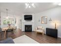 Bright living room with a fireplace, stylish furnishings, and hardwood floors, perfect for entertaining at 4826 Sir Duncan Way, Raleigh, NC 27612
