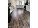 Bright kitchen features ample counter space, clean white cabinetry, and modern luxury vinyl plank flooring at 57 Winding Ridge Rdg, Sanford, NC 27332