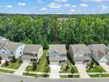 A charming home with a well-maintained lawn and inviting curb appeal in a quiet neighborhood at 1013 Poppy Fields Ln, Wake Forest, NC 27587