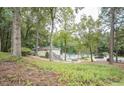 Community pool and clubhouse offering residents a place to relax and socialize in a serene, wooded setting at 12037 Deer Run, Raleigh, NC 27614