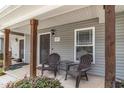 Inviting front porch with chairs, perfect for relaxing and enjoying the fresh air in a cozy setting at 121 Longleaf Pine St, Clayton, NC 27527
