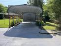 Carport with concrete pad and protection from the elements at 129 S Bullock St, Henderson, NC 27536