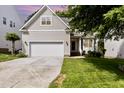Well maintained home with a two-car garage, manicured lawn, and classic curb appeal at 1304 Trailing Rose Ct, Wake Forest, NC 27587