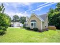 Attractive home with lush greenery, well-kept lawn, and a clean exterior at 1309 Sweet Charm Ln, Knightdale, NC 27545