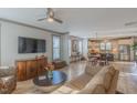Open-concept living area with hardwood floors seamlessly connecting the living room to the kitchen at 1624 Tunnel St, Wendell, NC 27591