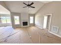 Bright living room showcasing a modern fireplace, light-filled windows, and spacious layout at 168 Clayton Rd, Princeton, NC 27569