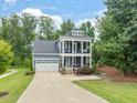 Charming two-story home with a two car garage and inviting double porches at 1804 Amberly Ledge Way, Cary, NC 27519