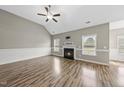 Comfortable living room with hardwood floors, fireplace, and vaulted ceiling for a modern touch at 241 Fox Run, Benson, NC 27504