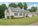 Beautiful home with landscaped yard, showcasing architectural details and a well-kept lawn at 33 Bluestone Dr, Smithfield, NC 27577