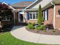 Well-maintained home with brick exterior, manicured landscaping, and inviting walkway at 3409 Bennyfield Ct, Fuquay Varina, NC 27526