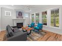Inviting living room featuring fireplace, hardwood floors, and lots of natural light at 414 Wyndham Dr, Chapel Hill, NC 27516