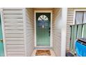 Close up of the front door with a decorative 'Home Sweet Home' mat and stylish hardware at 4736 Walden Pond Dr, Raleigh, NC 27604