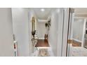 Inviting hallway with elegant decor, leading to other rooms in this beautifully designed home at 4736 Walden Pond Dr, Raleigh, NC 27604