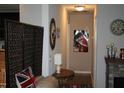Hallway with a decorative screen, an oval mirror, and artwork adding a touch of elegance at 503 N Franklin Dr, Sanford, NC 27330