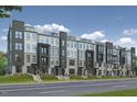 A row of new modern townhomes exhibits great curb appeal along a well manicured right of way at 509 Kildaire Farm Rd # 103, Cary, NC 27511