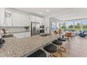 Spacious kitchen features a large island with granite counters, stainless appliances, and an open floor plan at 509 Kildaire Farm Rd # 103, Cary, NC 27511
