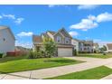 Beautifully landscaped front yard leads to this charming two-story home with a convenient two-car garage at 525 Willow Breeze Ct, Zebulon, NC 27597