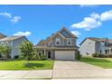 Beautiful two-story home with a well-manicured lawn, and convenient two-car garage, perfect for Gathering living at 525 Willow Breeze Ct, Zebulon, NC 27597