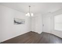 Dining room featuring a modern chandelier, closet, and natural light at 600 Audubon Lake Dr # 4B11, Durham, NC 27713