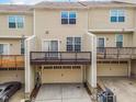 Rear exterior showcasing balconies and garage access, offering ample parking and outdoor space at 6027 Kentworth Drive. Dr, Holly Springs, NC 27540