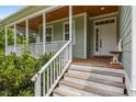 Front entrance featuring a light and bright porch and well-maintained steps at 100 Virginia Lee Ln, Efland, NC 27243